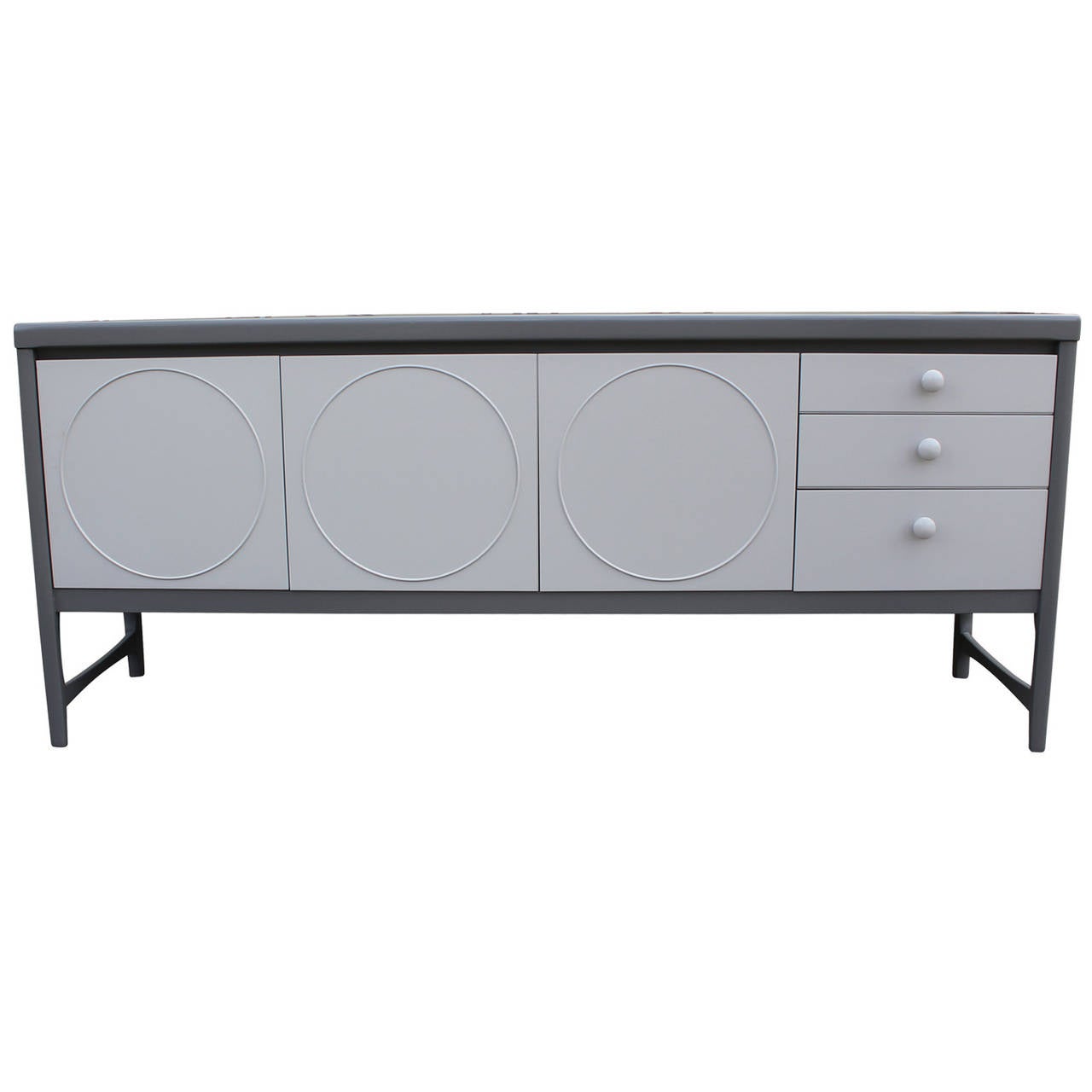 Elegant sideboard freshly lacquered in a two tone grey. Door fronts have nice circle details. Left door drops down. Two center doors open to a single shelf. Top drawer is slotted for service.