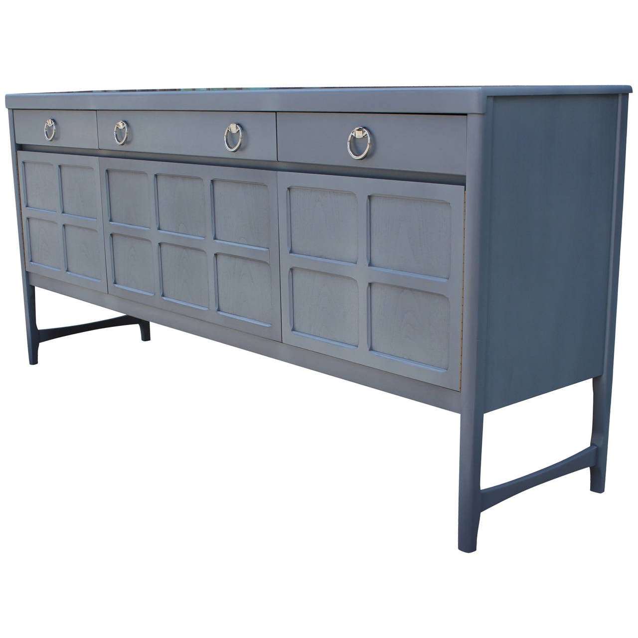 Light grey-blue sideboard with chrome handles. Sideboard or Credenza is made out of mahogany and teak. The piece has been stained a beautiful pale French Blue Grey color fully restored. Chrome handles. Front middle cabinet door drops down.