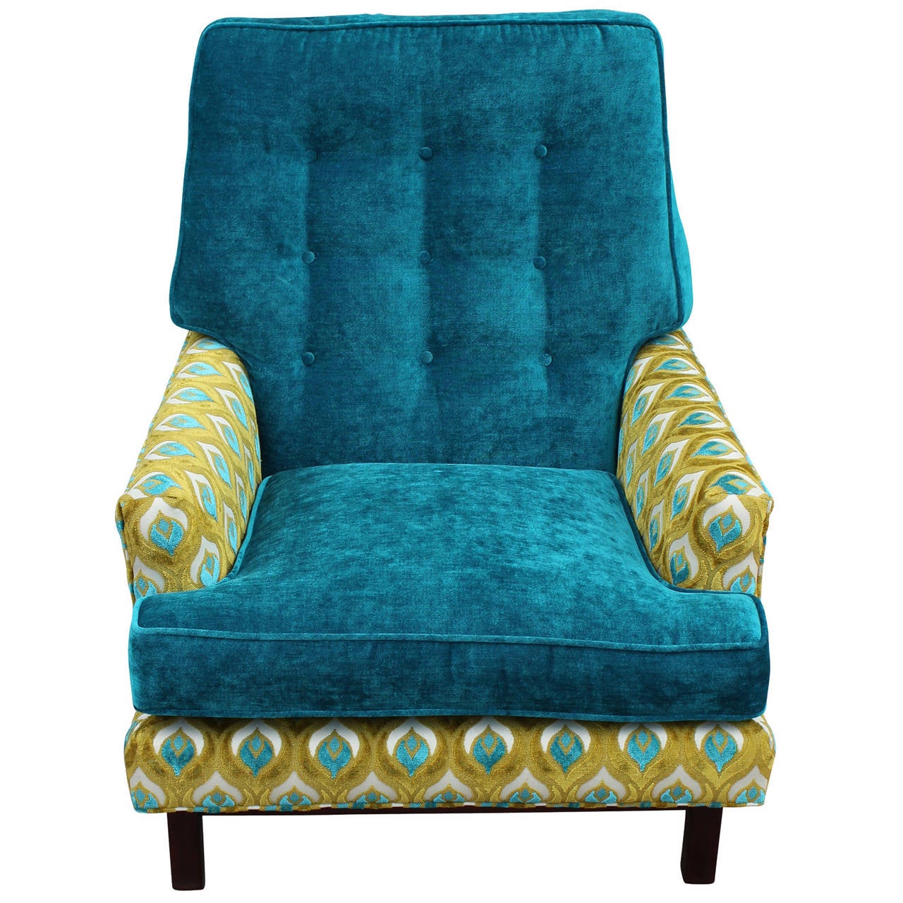 Wonderful armchair freshly upholstered in a patterned lime and peacock blue velvet with complementing peacock blue cushions. Wood base is stained a dark brown. Chair sits extremely comfortable. Perfect reading chair or focal point!