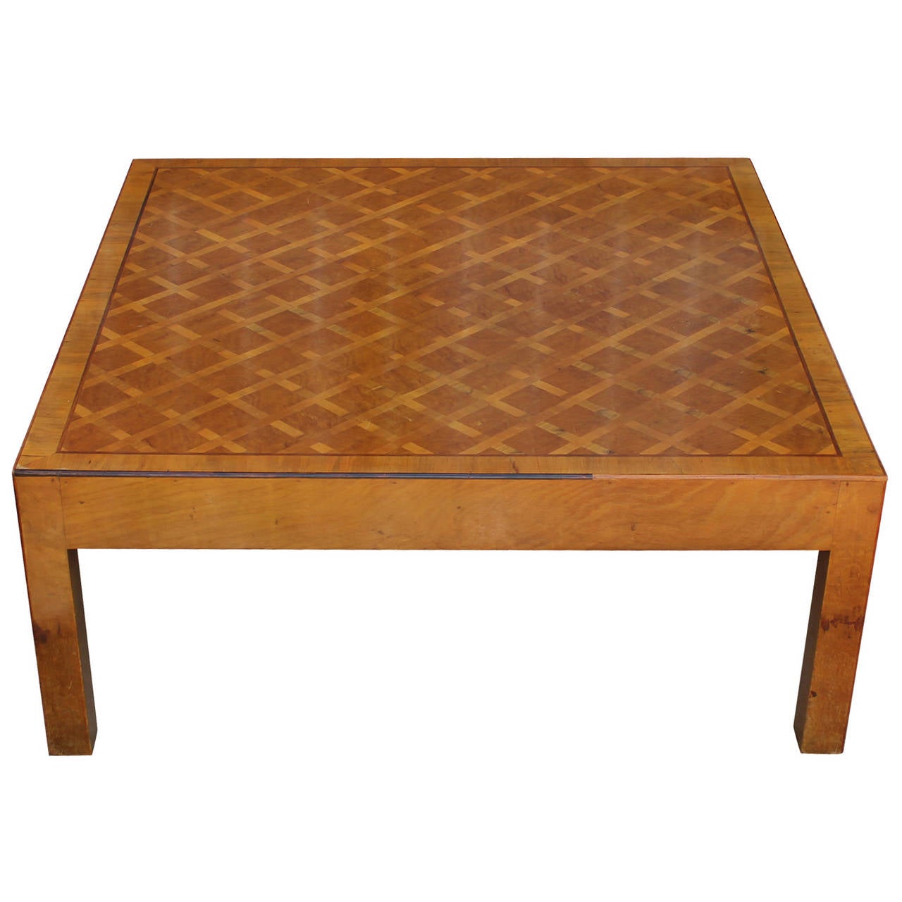 Fabulous Parsons style coffee table. Table top has a beautiful inlaid grid pattern. Clean lines and an extraordinary attention to detail make this coffee table the perfect transitional piece. Veneer is in excellent condition.