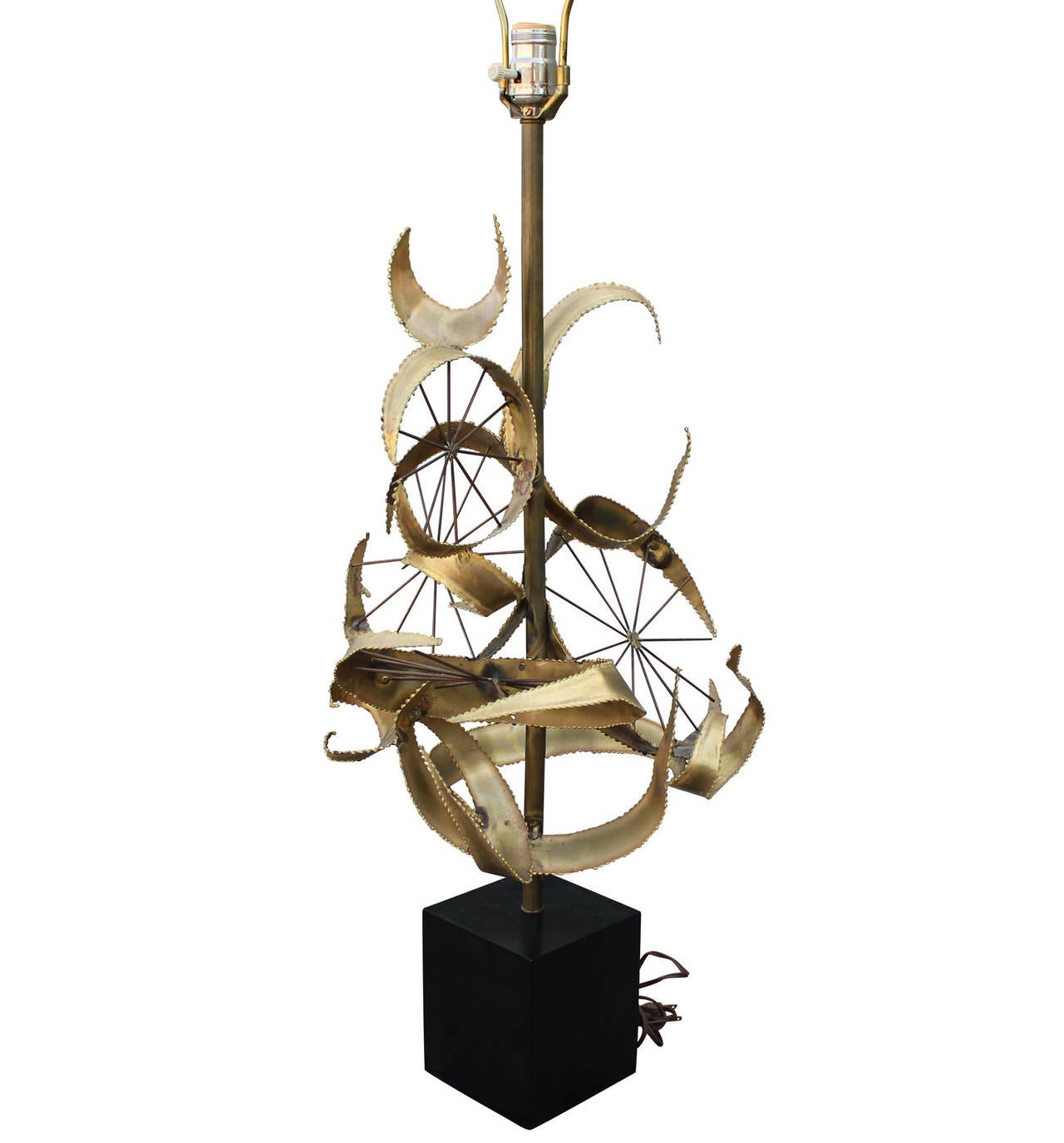 Stunning brass lamp by Curtis Jere. Lamp is constructed of brass with great movement. Height to bulb 33