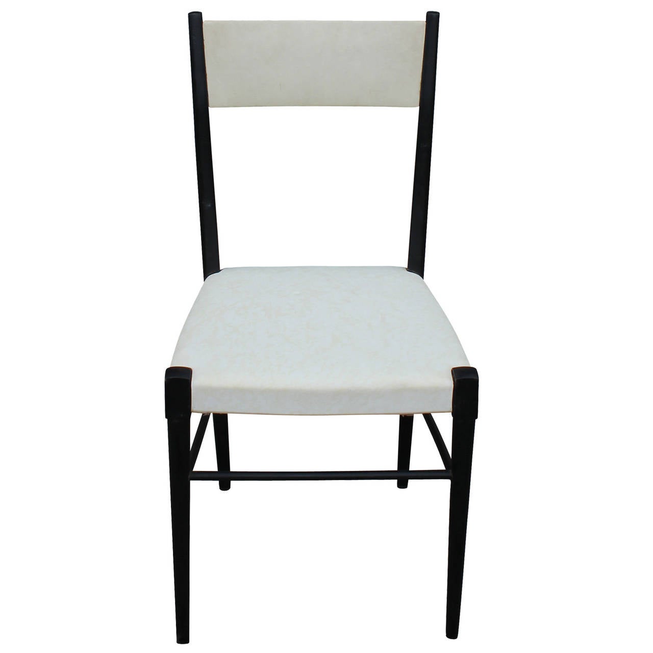 Set of six modernist, high back Italian dining chairs. Chairs have delicate tapered frames lacquered in black. Floating back rests and seats are upholstered in the original white vinyl. In nice vintage condition.