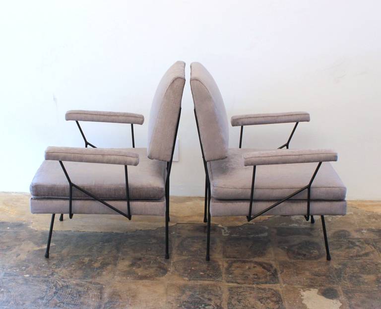 Unusual pair of petite wire frame restored Italian side chairs circa 1955. Reupholstered in a silvery gray velvet. Simple and elegant design for a perfect accent.