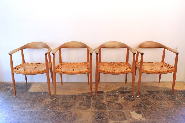 Great early set of four oak Hans Wegner chairs for Johannes Hansen in original condition. Chairs are in need of restoration, they have never been touched.