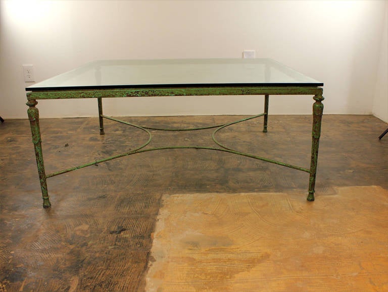 Georgeous iron table in with perfectly patinaed green paint circa early 20th century.  Could be used outdoor or indoor. Slight stress crack behind one leg but is structurally sound.