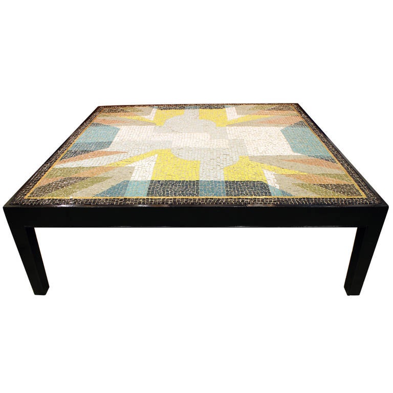 Incredible mosaic tile table with a black base. Would make a beautiful focal point in any room. Table is in good vintage condition. Possibly Dunbar.
