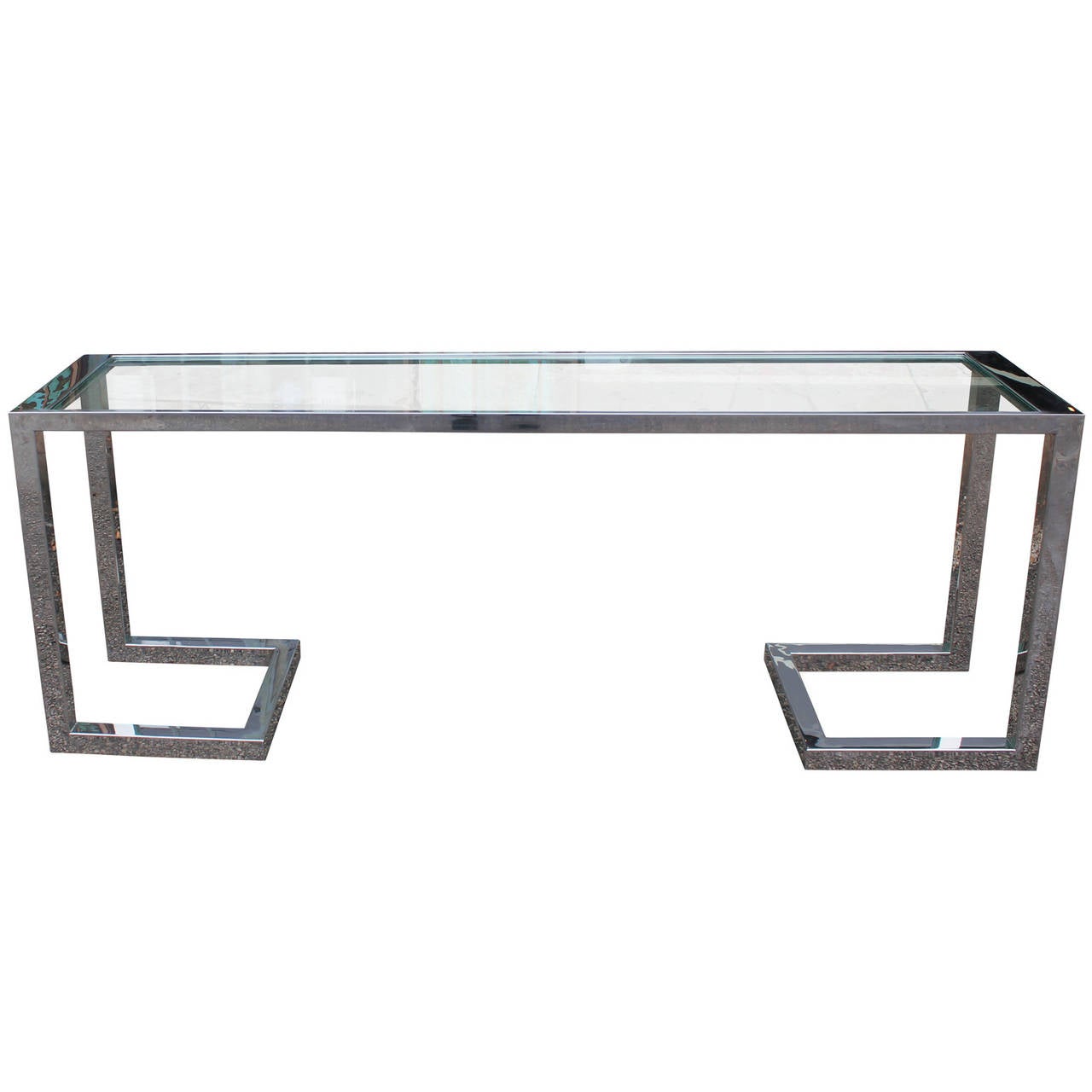 Clean lined chrome and glass console table. Heavy architectural chrome base is highly polished and in excellent vintage condition.