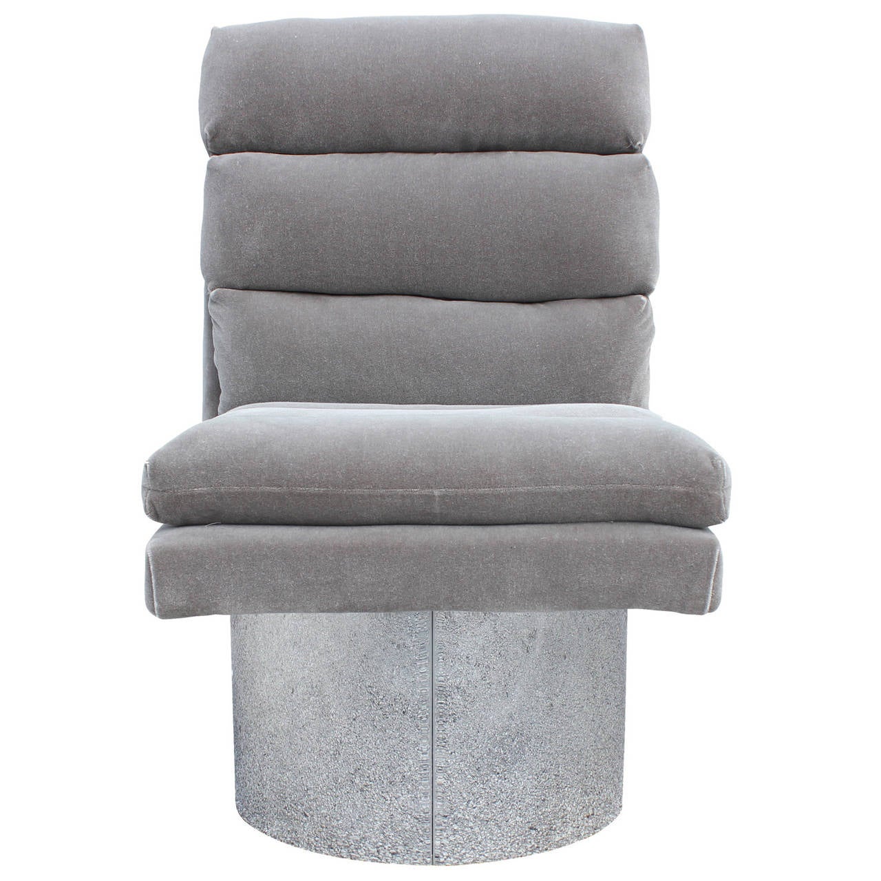 Pair of swivel lounge chairs on shiny chrome cylindrical bases. Freshly upholstered in grey mohair velvet. Chair swivels side to side but always snaps back to center. Great statement pieces. Inquire for an additional two chairs! In the Style of Paul