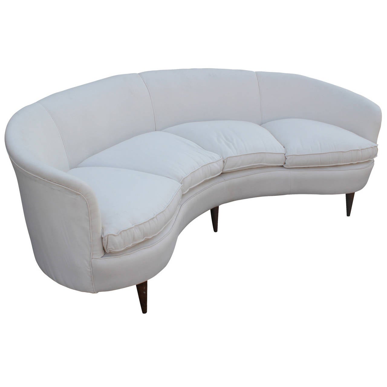 Large and glamorous curved Italian four seat sofa. Sofa has elegant swooping lines. Feather filled cushions. Six tapered legs are finished in a medium walnut. White woven upholstery is in great shape.
Overall Depth is 42