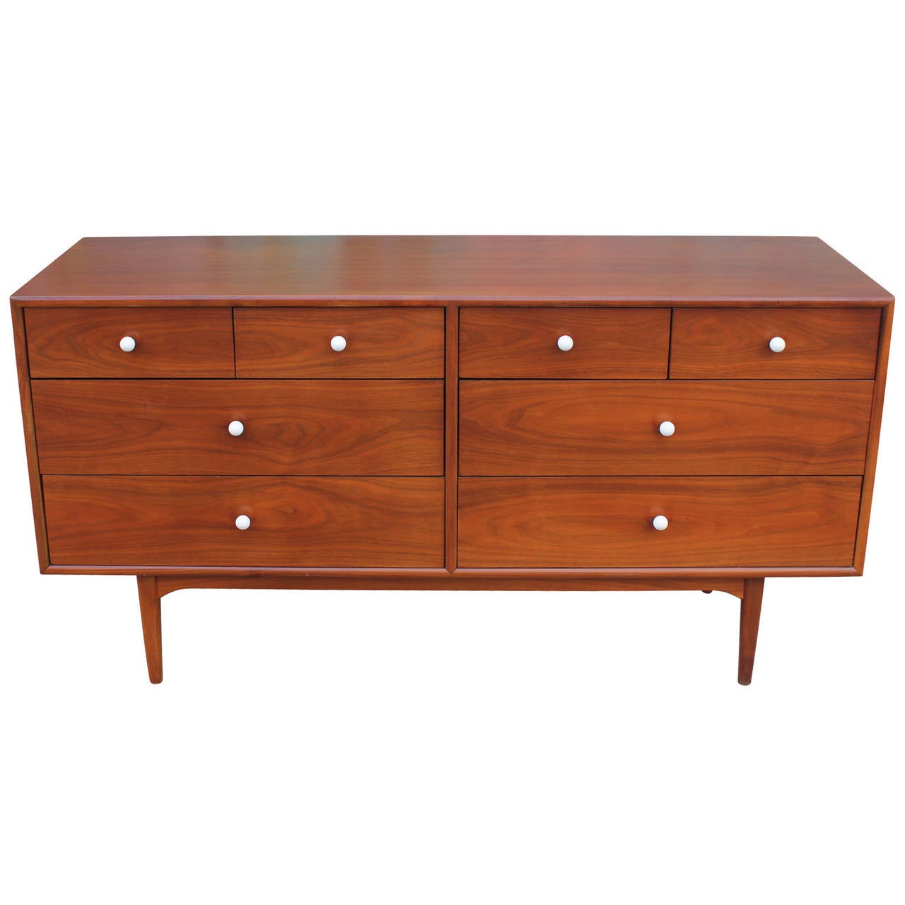 Beautiful Kipp Stewart for Drexel figured walnut 8 drawer dresser with white porcelain knobs. The dresser was made in 1961 and is the Declaration line. It is in excellent restored condition.