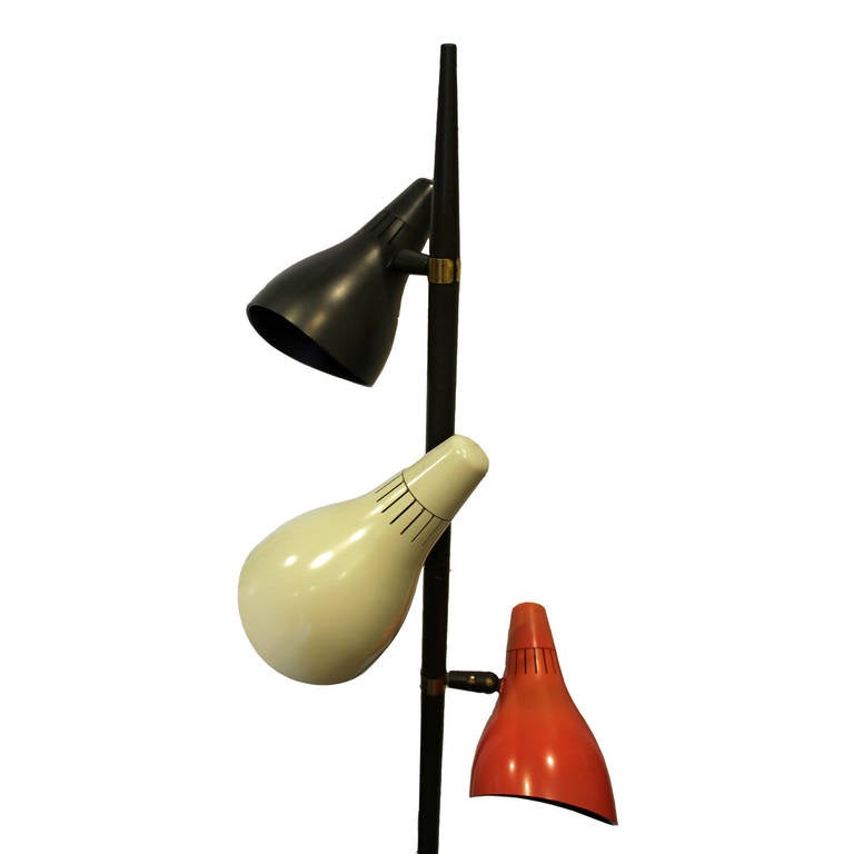 Great pair of Lightolier floor lamps possibly by Gerald Thurston. The color shades are also the switches. Brass accents in the middle. Lamps are in nice vintage condition with minimal wear. Can be sold separately.