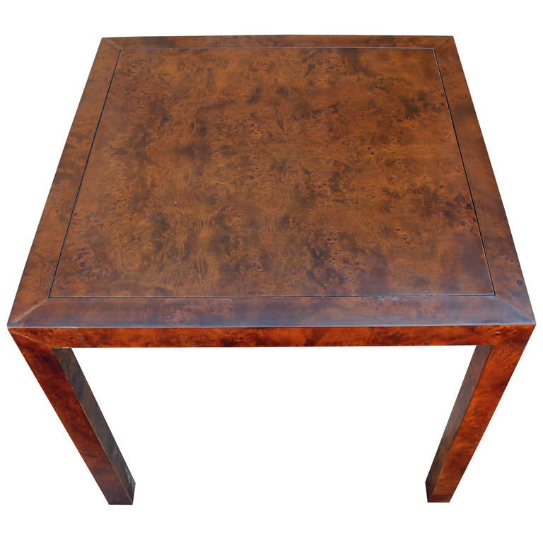 The simple lines of this table allow the gorgeous burled walnut to take center stage. The table is in great condition and would be a perfect addition to a game room or small dining area. Attributed to Dunbar.