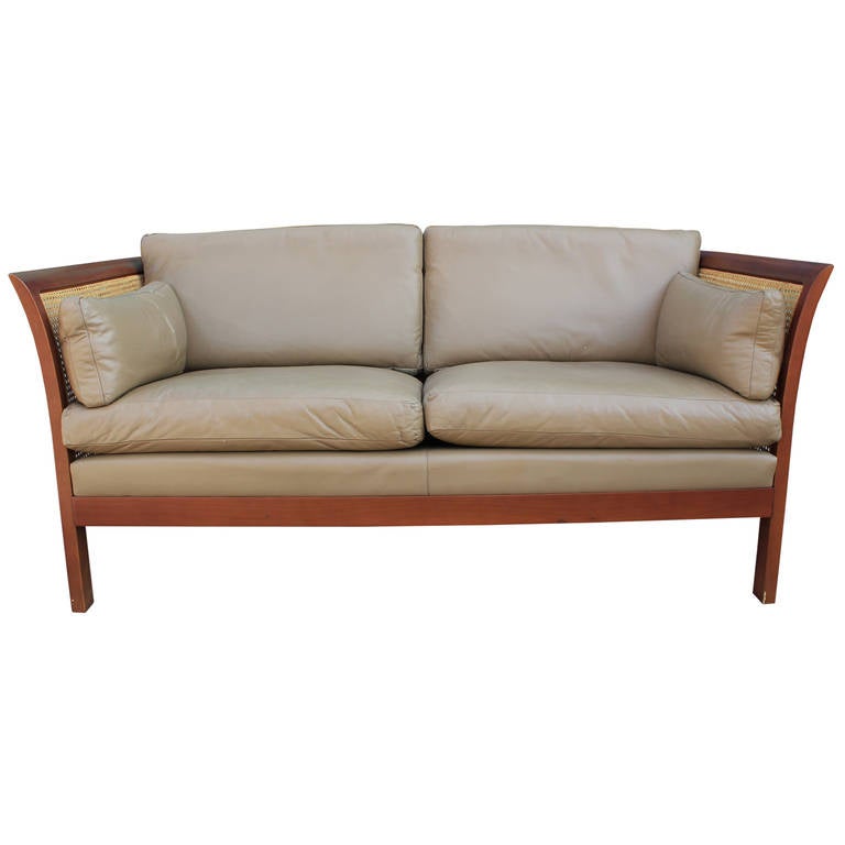 Great Arne Norell Leather sofa with cane sides and back. Very comfortable. Made in Sweden.