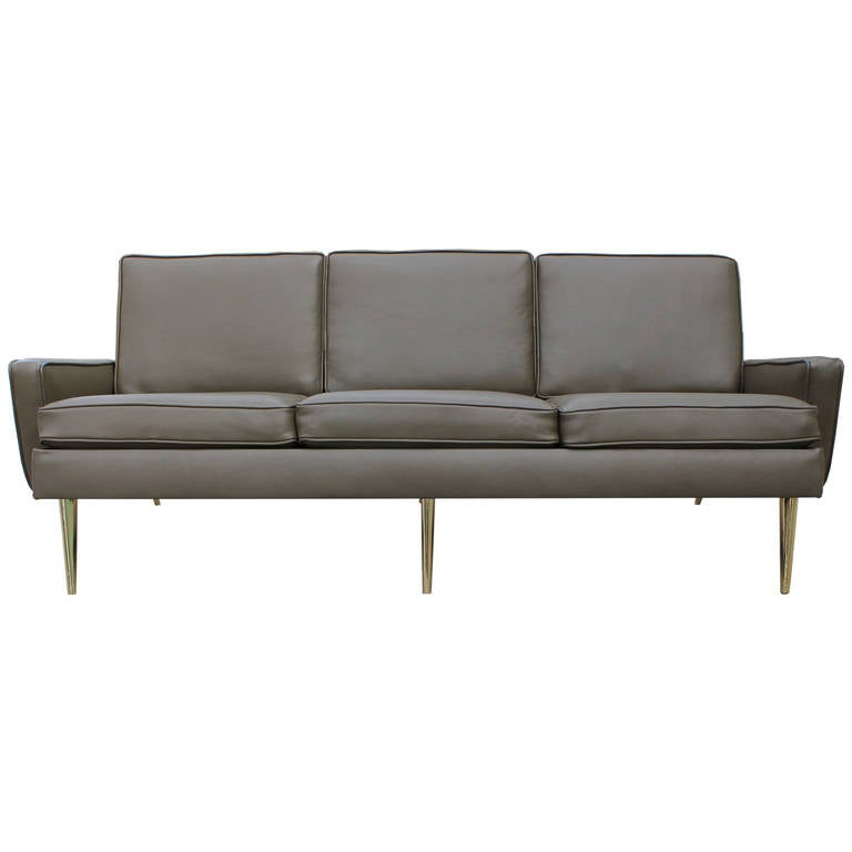 sofa with brass legs