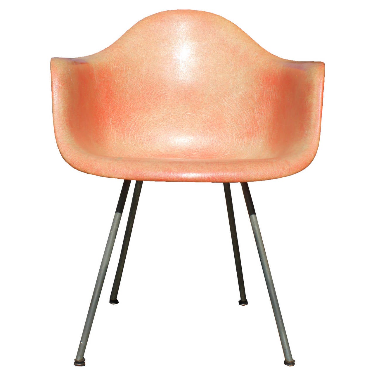 A fiberglass Zenith chair designed by Eames for Herman Miller in a salmon color with rare rope edge detail. The chair retains the original label and is in all original condition. Light fading consistent with age.