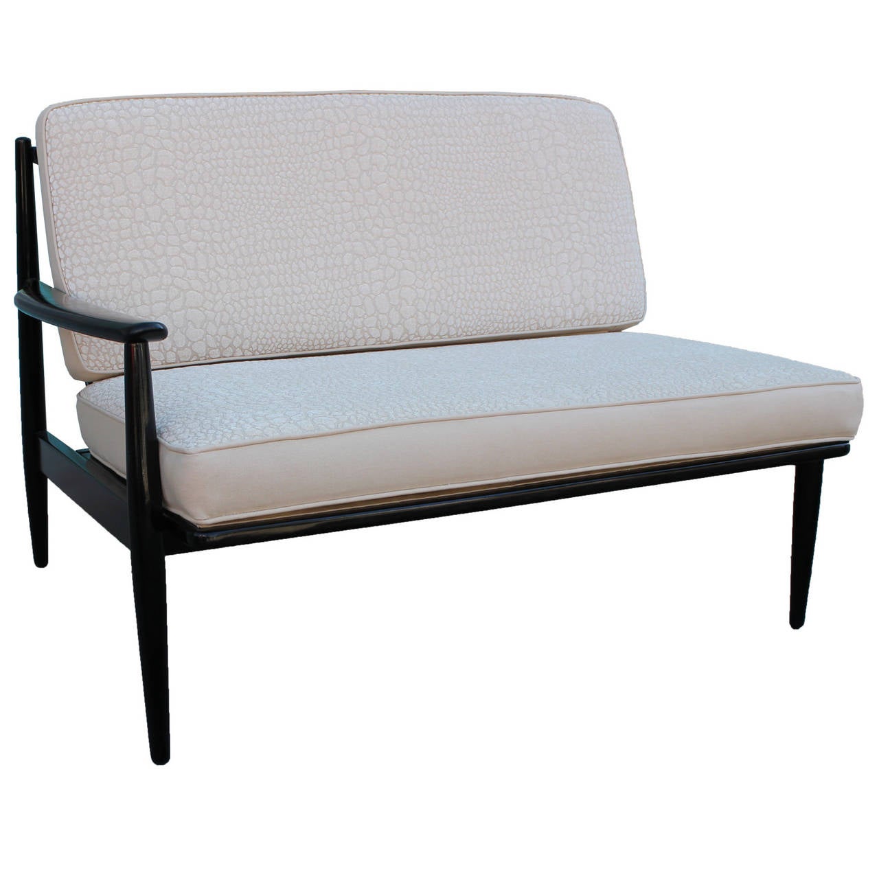 Unusual asymmetrical settee finished in black lacquer. Two tone upholstery with beige canvas and a beige textured crocodile chenille.  Cushions unzip for easy care.