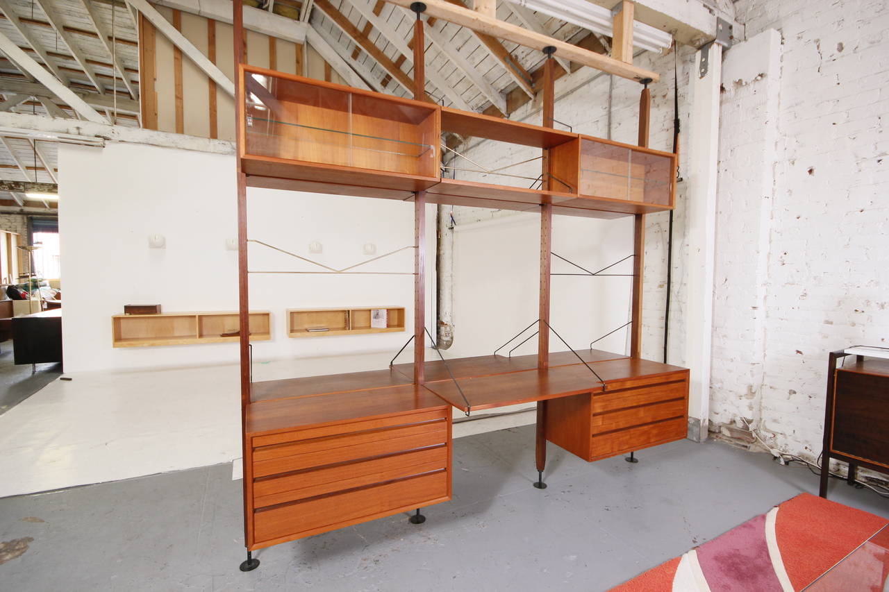 Absolutely stunning Danish Modern suspension Cado wall unit or double-sided room divider with two desks. Up to 9 foot high ceilings, designed by Poul Cadovius, circa 1960s.