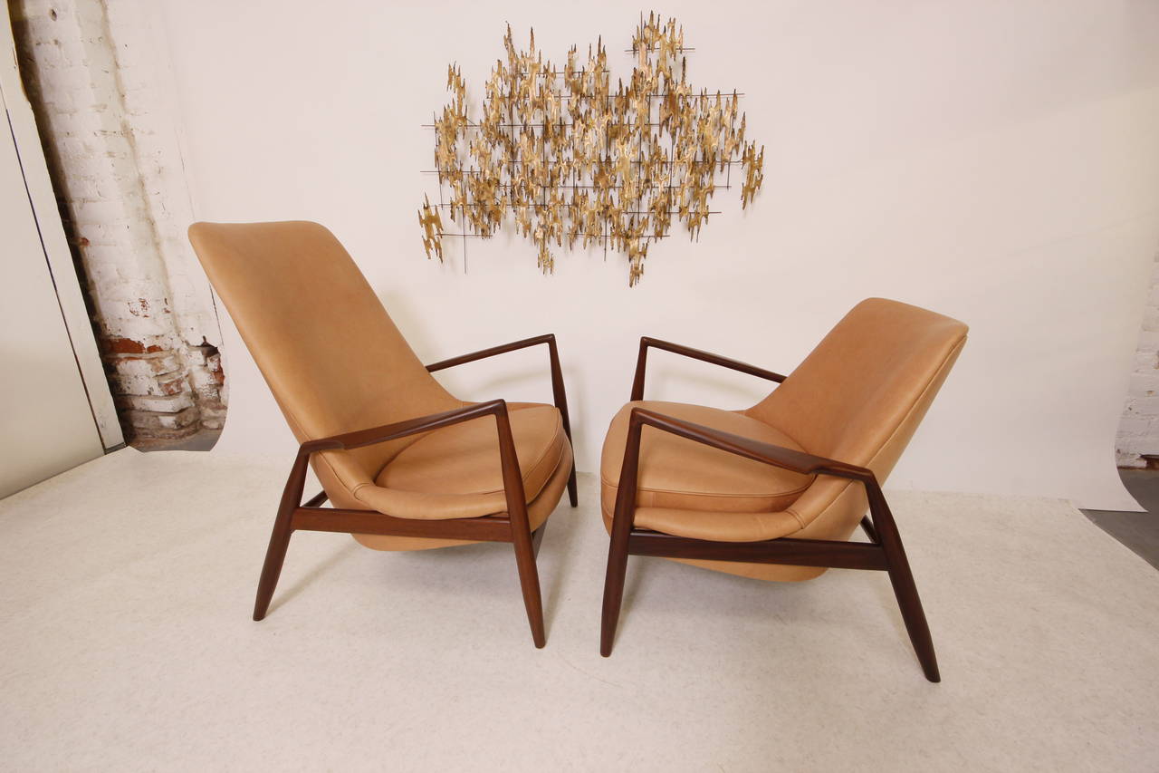 Extreme Rare Pair of Danish Modern His & Hers Lounge Chairs by Ib Kofod Larsen, Ultra Soft Tan Leather That Will Look Even More Amazing Over Time,  The Frames are Made of African Teak or Afrormosia, A Darker and Rarer Teak. 
Newly Refinished and