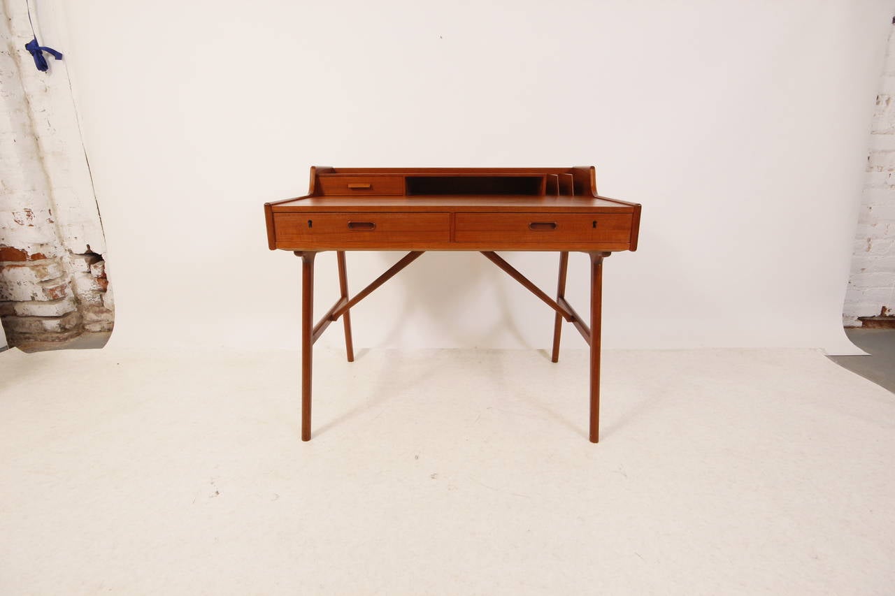 Danish teak desk by Arne Wahl Iversen for Vinde Mobelfabrik. Plenty of storage. Great size and beautiful form.