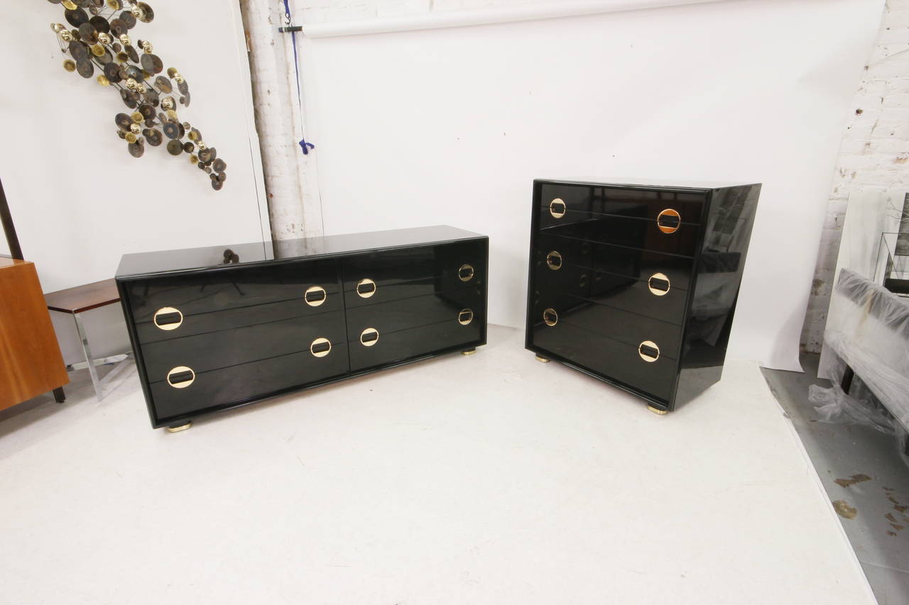 Absolutely stunning black lacquer and brass bedroom set. Piano finish lacquer and newly refinished brass pulls.