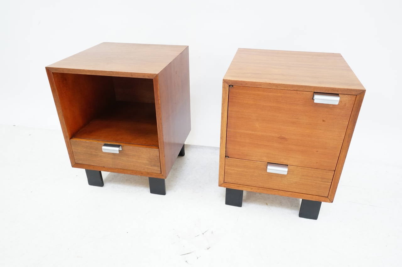 Gorgeous pair of Mid-Century Modern walnut nightstands designed by George Nelson for Herman Miller, circa 1950s.