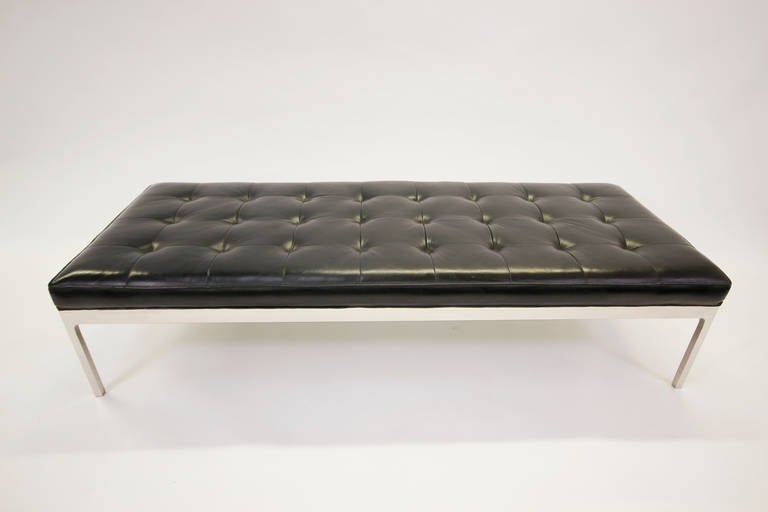 Gorgeous original button tufted black leather cushion with polished stainless steel frame.Very high quality and heavy bench, all original with label on the bottom. We have two available.