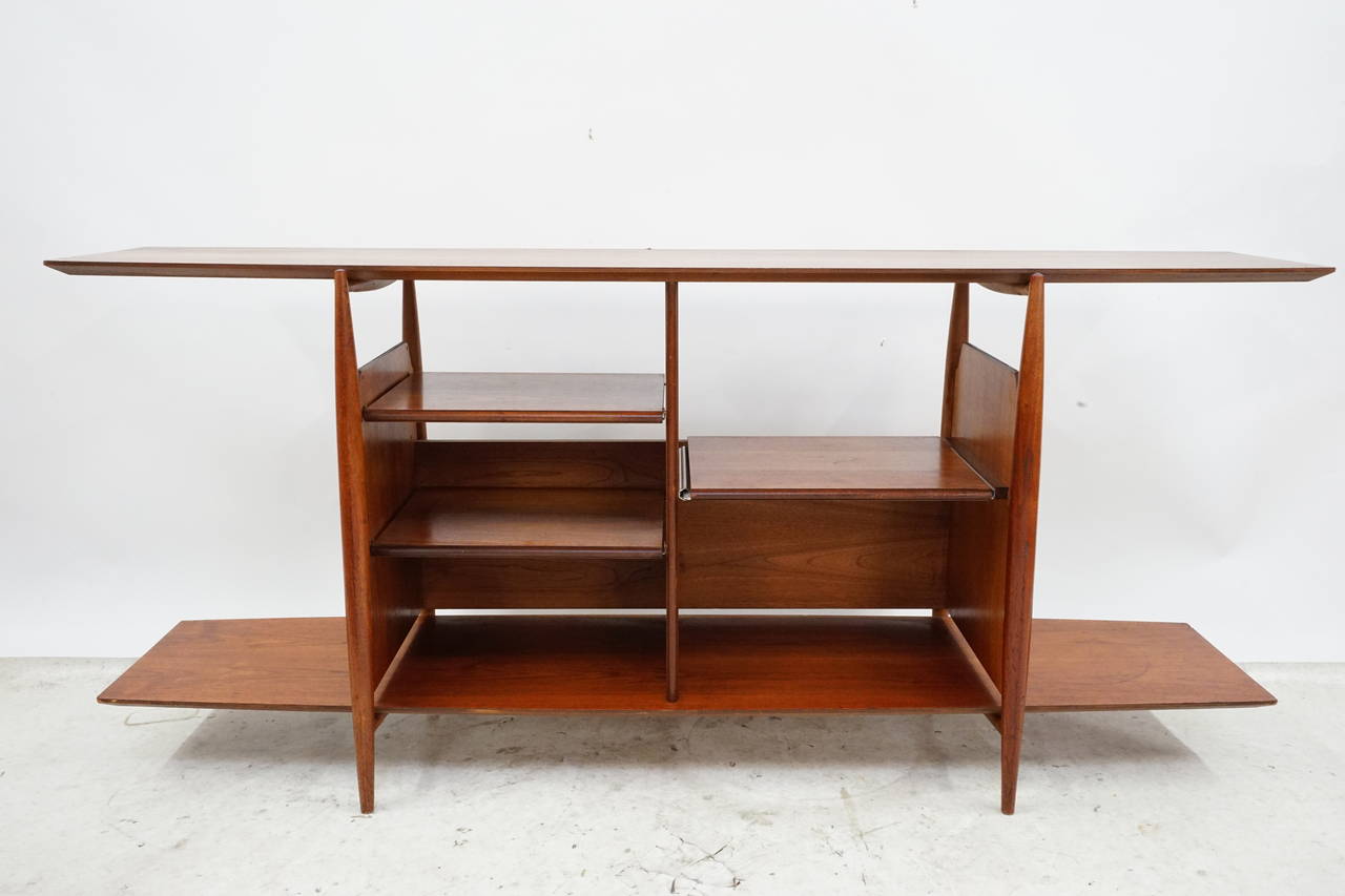 This is a very cool piece designed by Kipp Stewart with sculpted walnut detail and pull-out turn table shelf, plenty of room for amps, turn tables you name it! I think this would be amazing sitting under a large mounted flat screen TV, circa 1970s.