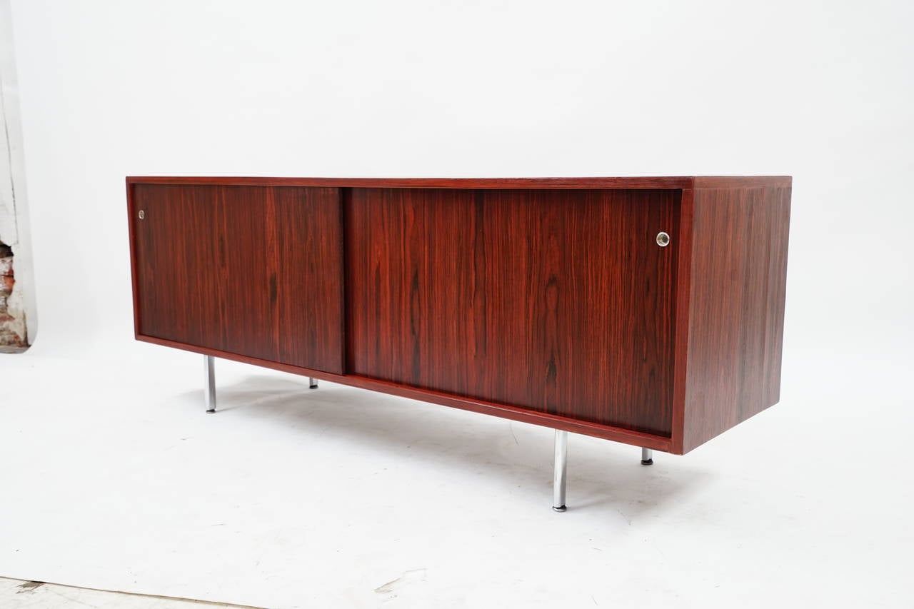 Amazing Rosewood Credenza with sliding doors and thin chrome legs by George Nelson, Circa 19690's