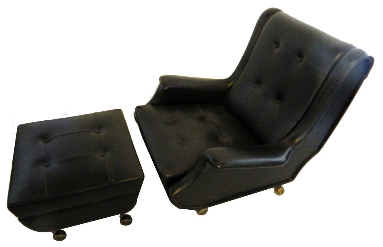 Exceptional chair and ottoman by Marco Zanuso, Arflex editor.
Original black leather, chair and ottoman on casters.
Measures: Chair 33 H, 31 W, 33 D overall, 27 D seat, 16 H seat, 21 W seat, 24 H back seat.
Ottoman 22 by 22, 16 H.