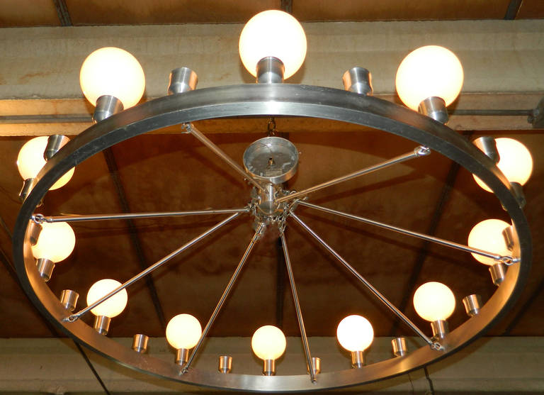 Pair of Industrial looking chandelier, made by the lamp maker de Beloeil.
24 lights.
US wired and in working condition.