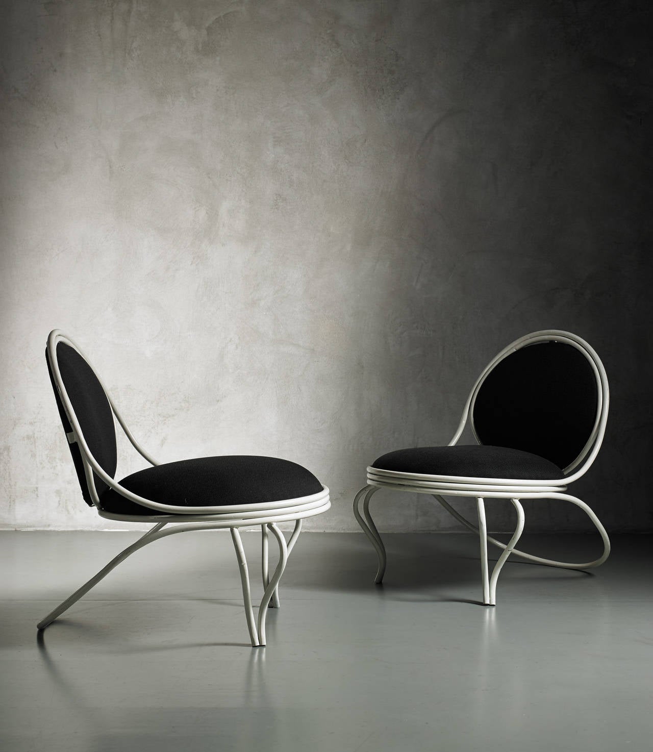 Pair of low armchairs by Mathieu Mategot
France, 1971
Laquered white metal, black cotton