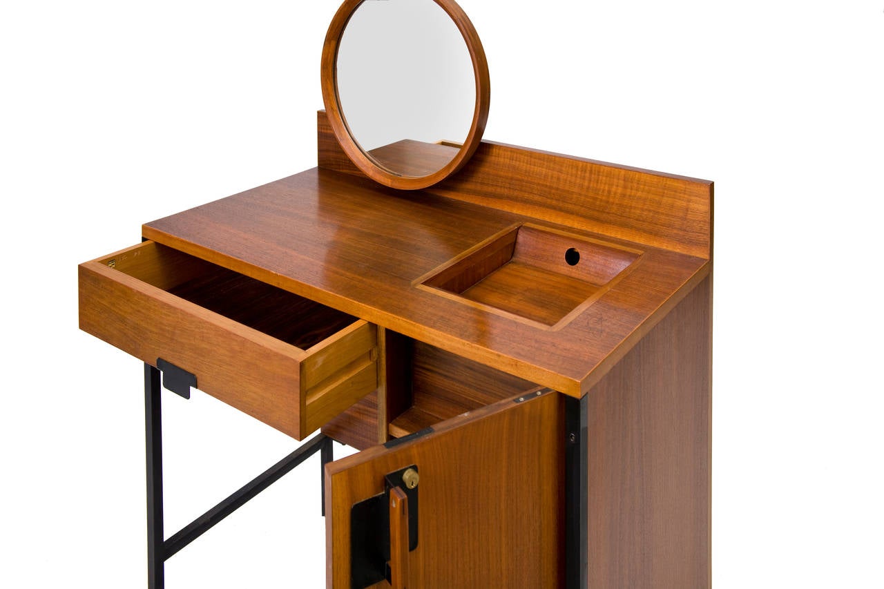 A Positano vanity table with a 691 chair by Ico Parisi 
Italy, table 1959, chair 1955
dressing table manufactured by MIM, chair made by Cassina
dressing table: walnut wood veneer, varnished steel and brass adjustable feet 
original