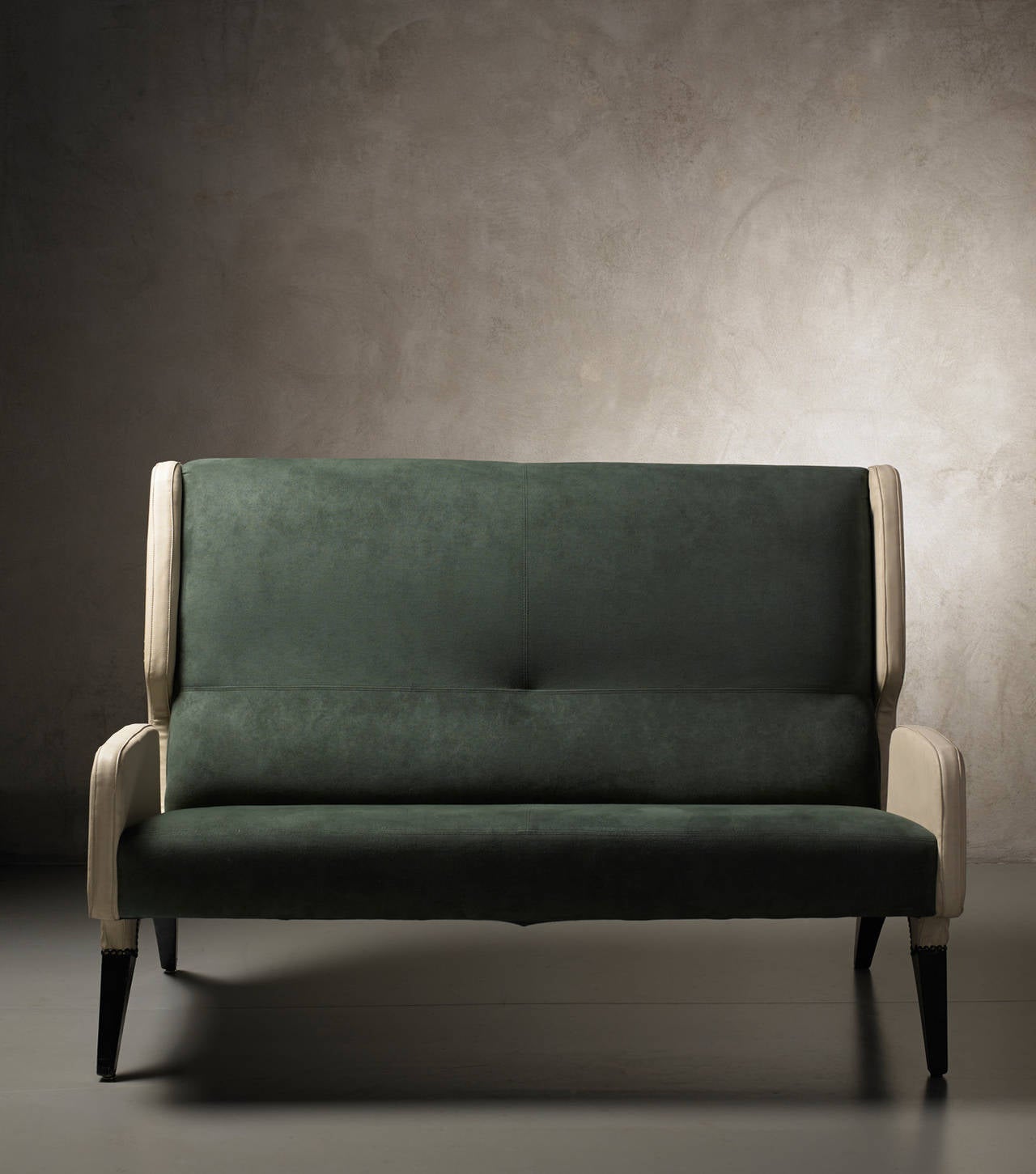 High seatback sofa by Gio Ponti
Italy, 1964
Designed for Hotel Parco dei Principi, Rome
Manifactured by Cassina
Wood structure with skai and alcantara upholstery