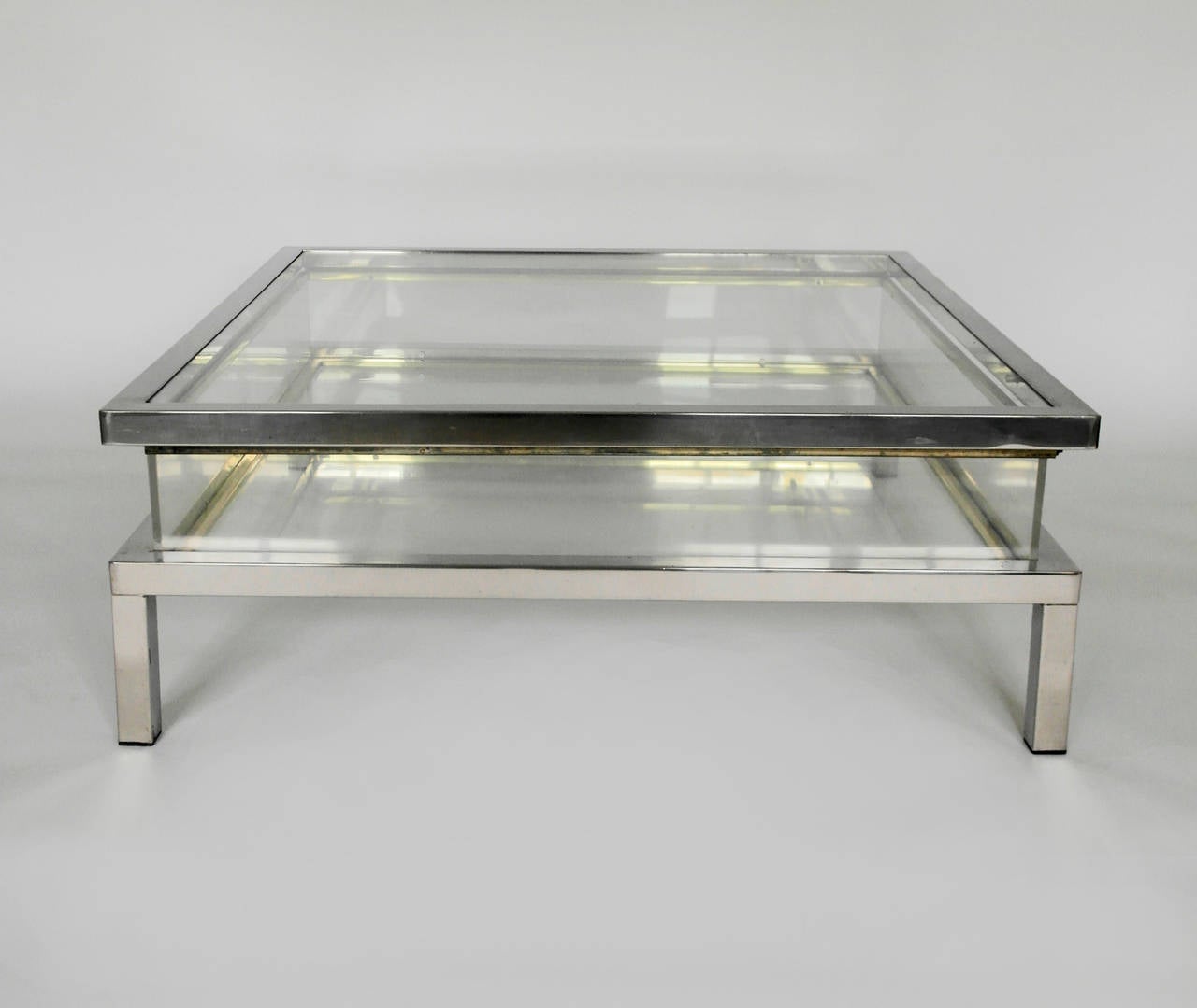 Perspex box coffee or cocktail table with sliding glass top and high polished chrome edging. Unsigned piece 1970's, in great decorative order.