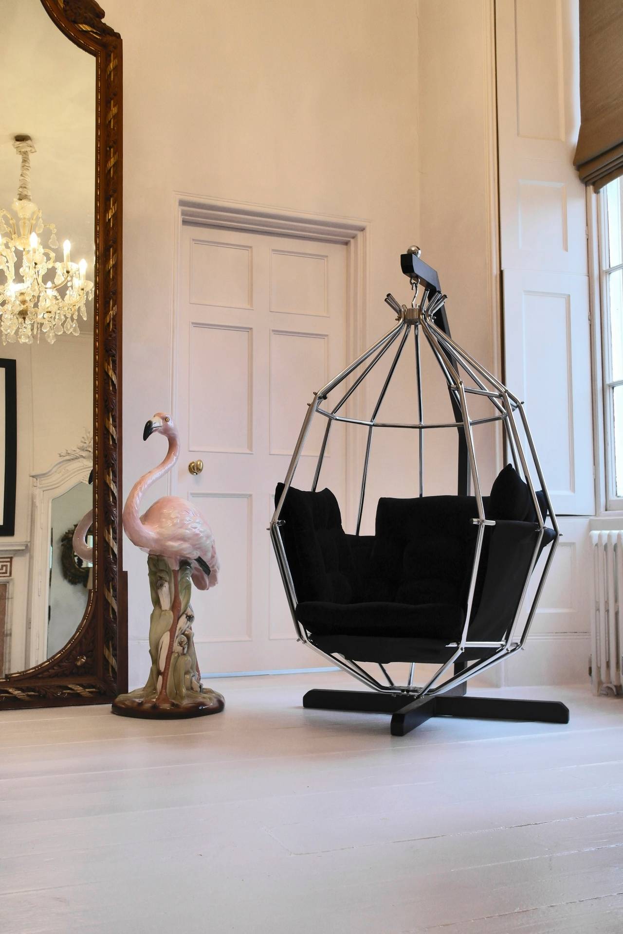 The Parrot Chair by IB Arberg is an iconic retro look from the designer. The chrome birdcage chair is suspended by a steel frame and features a sumptuous button back seat, freshly re-upholstered in black velvet.

Some scratches to paintwork on