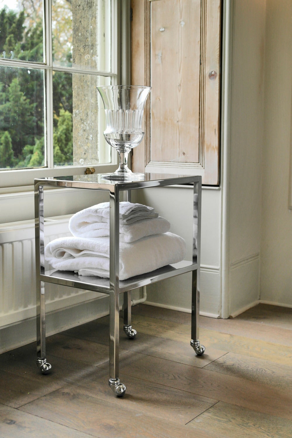 Industrial style trolley, late 20th to early 21st century design by Philippe Starck. High shine polished chrome finish, double shelf trolley on castors with square legs. Provenance; Tables are unsigned but have come from a 1999/2000 Philippe Starck