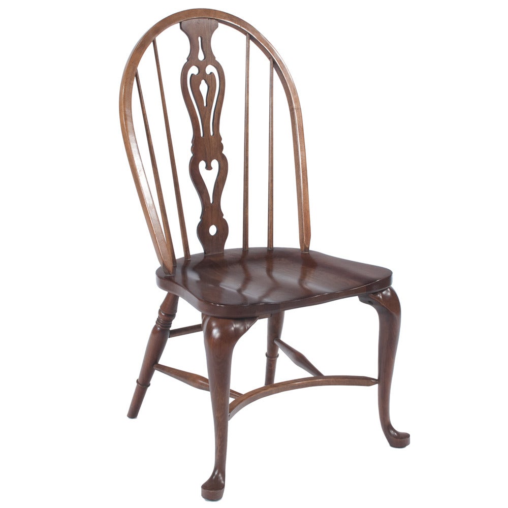 Matching set of six walnut English saddle seat Windsor chairs with Queen Anne legs and shaped stretchers featuring a pierced back splat, circa 1910. Seat height is 19.5