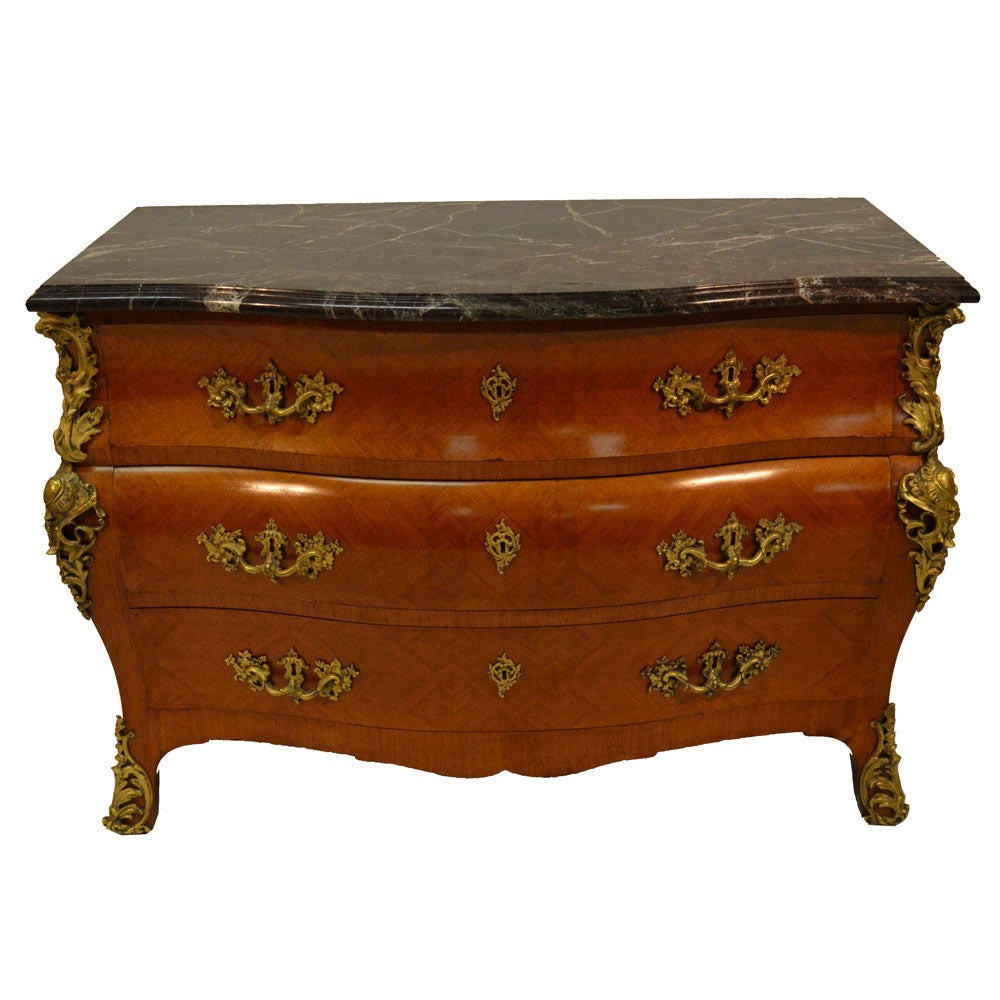 Marble-top three-drawer Bombay commode featuring all original antique brass pulls and marble top. Ormolu detail on either side as well as feet. This commode is in very good condition, no flaws on finish or marble.