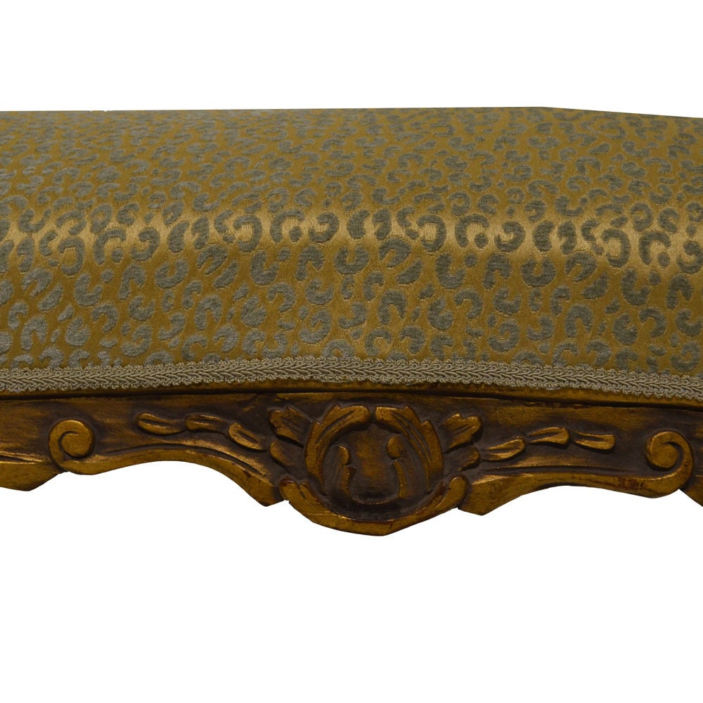 Antique Louis XV bench newly upholstered in a gold and aqua small-scale
cheetah print. The cabriole legs have hand carved decorative motifs as well as the arms as well as an antique gold gilded finish.