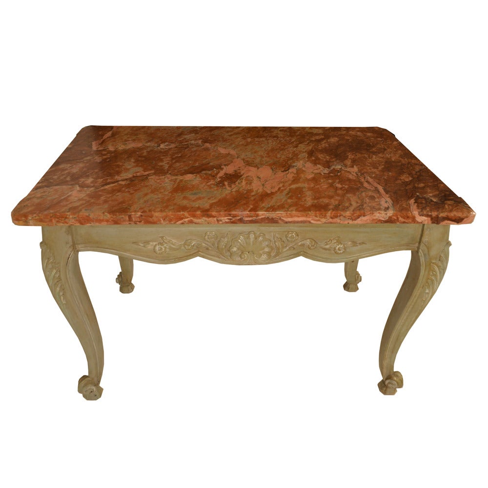 Louis XV marble-top writing table with antiqued bluish/gray finish and coral, brown, and cream marble. Hand-carved with a classical French motif, circa 1890.