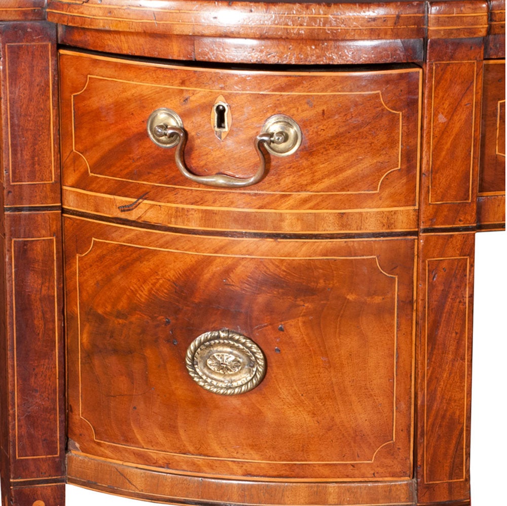 Inlaid Sheraton mahogany sideboard with brass gallery, string satinwood inlay on square tapered legs with spade feet. Brass gallery fully attached with no weakness. All parts original, circa 1790.