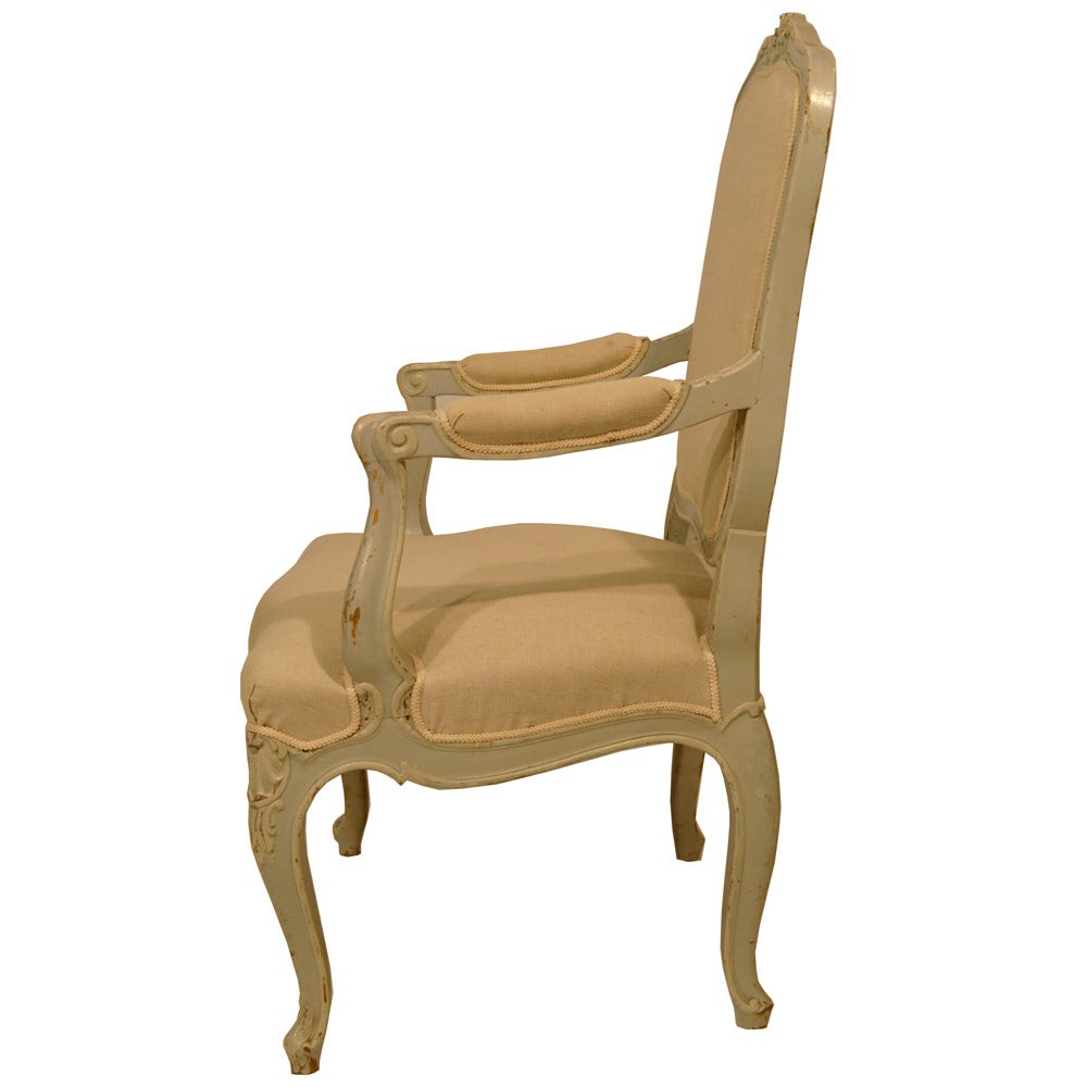 Louis XV fauteuils with antiqued painted aqua finish, cream linen fabric and cream French gimp. Seat height: 17