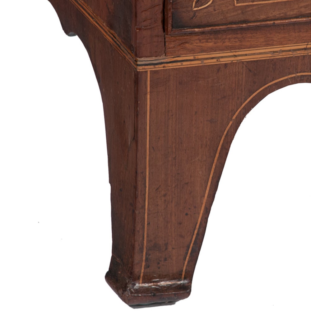 Inlaid Sheraton mahogany bow front chest with three small drawers over three full graduate drawers, shaped apron and splay feet, circa 1830.