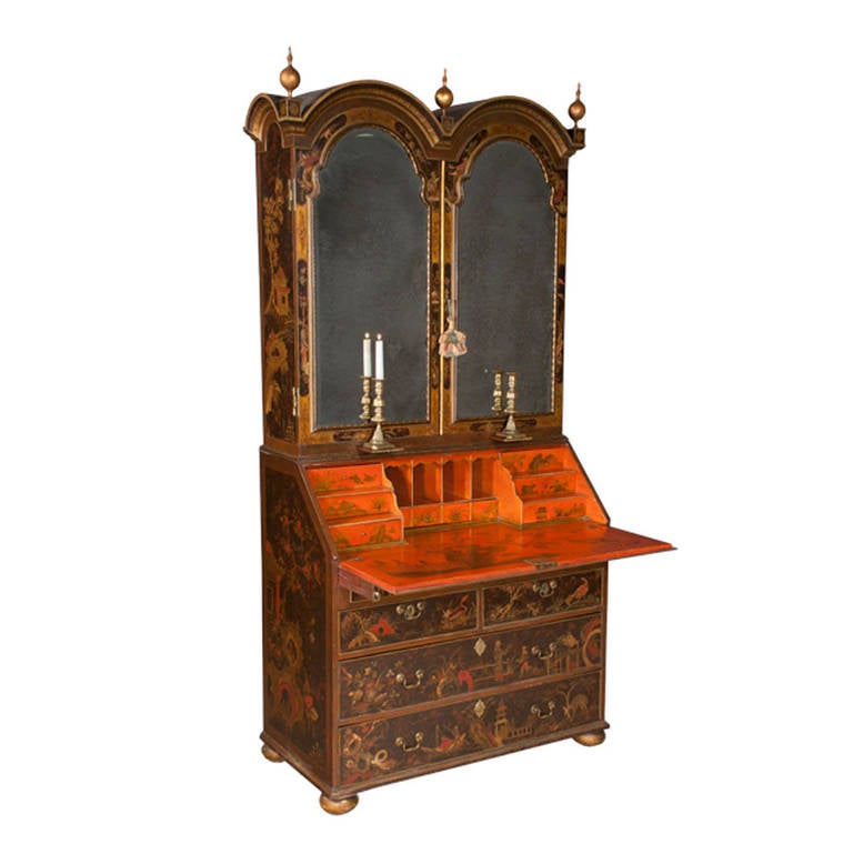 Queen Anne period double bonnet top bureau bookcase or secretary with tortoise-shell brown and gold chinoiserie lacquered decoration, elaborate fitted interior, gilt finials, and bun feet. Antiqued mirrored doors on front add to this very