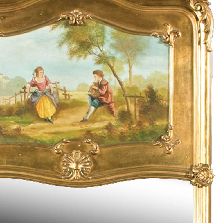 Louis XV gilded trumeau mirror with hand-carved onlay, as well as the classic oil painting above, featuring a couple in a garden scene. Excellent condition.