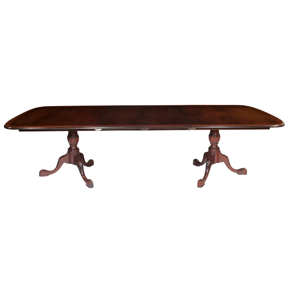 Two pedestal solid mahogany Queen Anne dining table with a burled walnut banded top, featuring tow 18