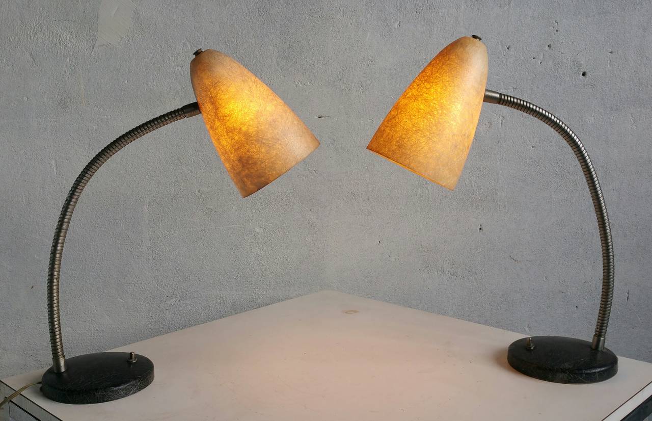 Unusual matched pair of adjustable gooseneck table lamps,, Beautiful spun fiberglass amber cone shades,,romantic glow when lit,,Rarely seen fiberglass bases,, push button on/off switch, Fully adjustable gooseneck standards,,  Classic Mid Century