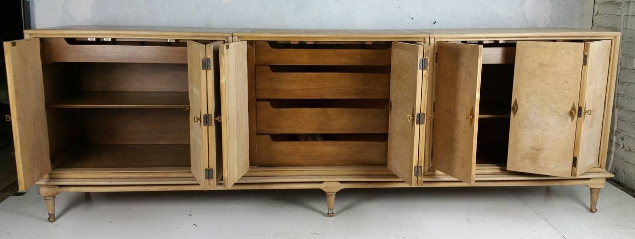 Stunning Mastercraft Cabinet.. burl wood,, handsome brass hardware,,  Classic design,, three seperate cabinets sitting on long plynth base,, Bi-fold doors open to shelves and drawers,,Retains original Mastercraft label,,