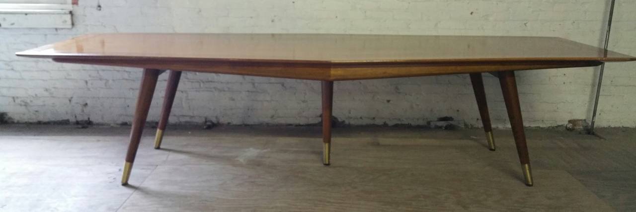 Wonderfully designed Mid Century Modern Conference or Dining table (10 feet) manufactured by Stow Davis,,Beautiful figured Solid walnut top,banded burl edge,Extreme splayed leg Superior Quality.,,Top tapers from center. four feet to three feet on
