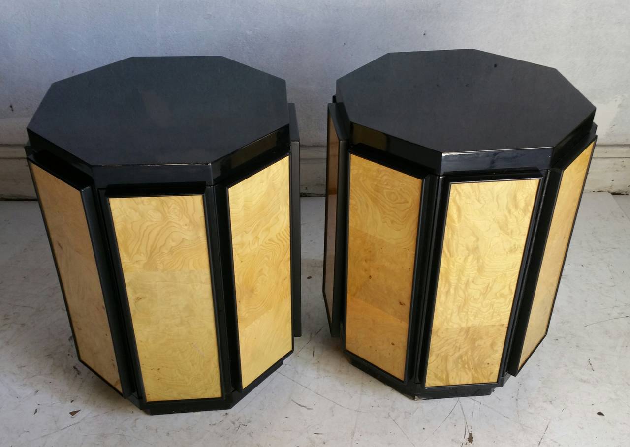 Matched pair of Night stands / end tables, manufactured by Henredon.. Stunning hexiagon form,,Dramatic two-tone,,Burl olivewood and black lacquer.Hidden hinged door opens up to 1 shelf storage,,